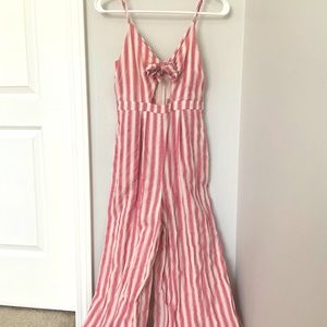 Pink striped jumpsuit with tie front